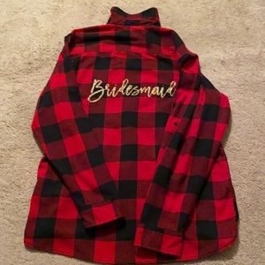 Buffalo plaid flannel button down with “bridesmaid” on the back.